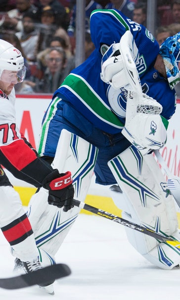 Roussel scores in return, Canucks beat Senators 5-2